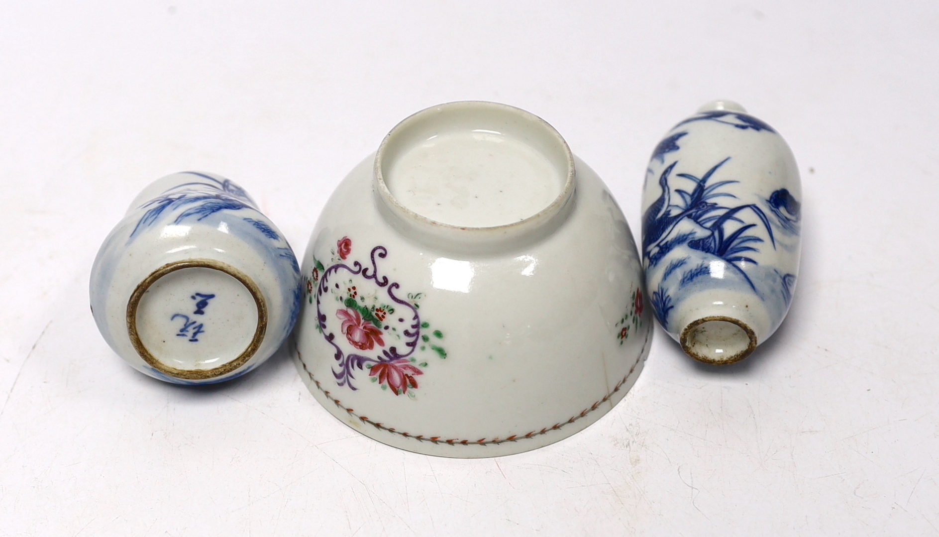 Two Chinese blue and white snuff bottles and a famille rose tea bowl, highest 7cm